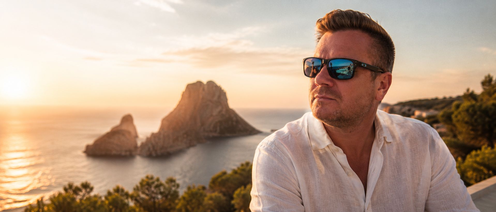 Gerome Christopher at sunset on Ibiza, looking out towards Es Vedrà